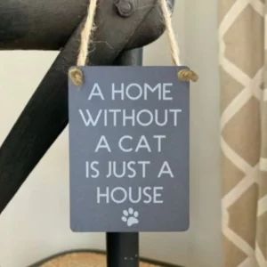 Mini metal sign reading “A Home Without A Cat Is Just A House” with paw print illustration.