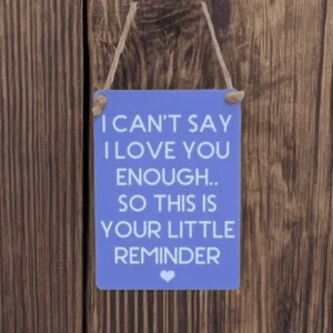 Mini metal sign with “I can’t say I love you enough, so this is your little reminder” message and heart illustration.