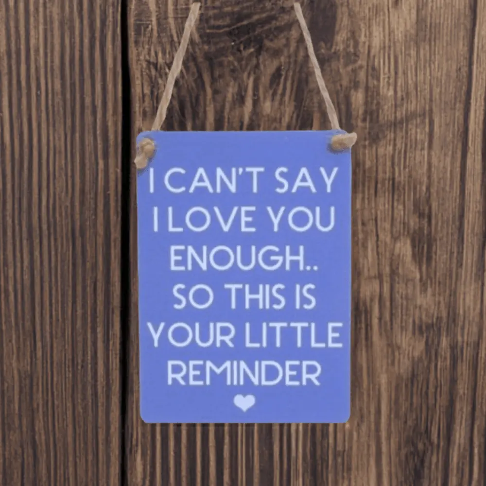 Mini metal sign with “I can’t say I love you enough, so this is your little reminder” message and heart illustration.