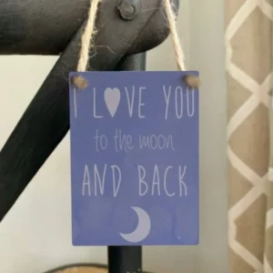 Mini metal sign with “Love You to the Moon and Back” quote and moon design