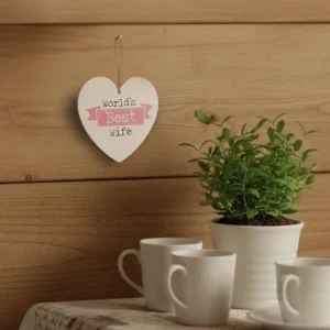 Wooden heart-shaped hanging sign with text “World’s Best Wife” in red and black letters, hanging by a jute rope