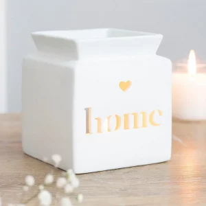 White matt ceramic oil burner glowing with tealight inside