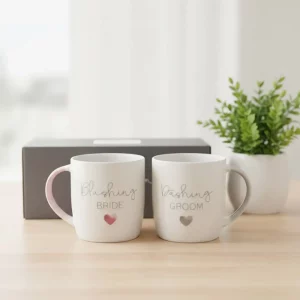 Blushing Bride & Dashing Groom mugs displayed on gift box