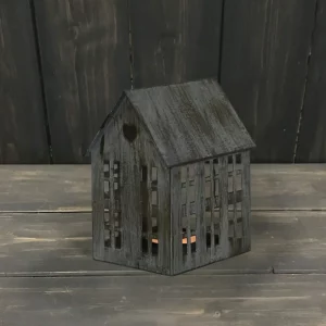 Grey distressed metal house-shaped tealight holder with cut-out windows and heart detail.