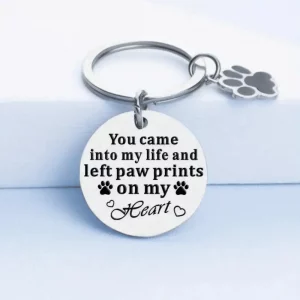 Stainless steel keyring engraved with the words “You came into my life and left paw prints on my heart,” with paw print charm.