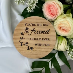 Round wooden coaster engraved with floral design and friendship quote – You’re the best friend I could ever wish for