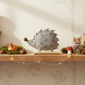 Grey felt hedgehog ornament with wooden base