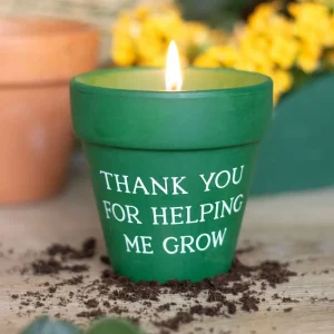 Lifestyle photo of citronella pot candle on a wooden table