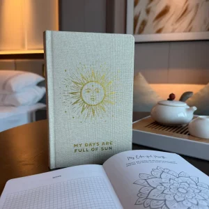 Open gratitude journal with mood tracker and gratitude sections