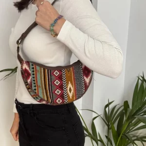 Jacquard shoulder bag shown worn on the shoulder