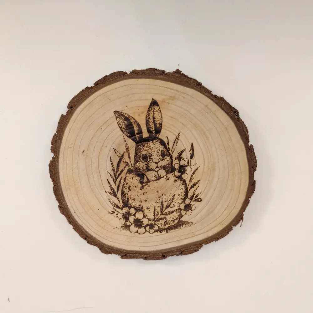 rabbit engraved log coaster with floral detail